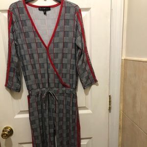 Black and white striped jumpsuit red stripe..